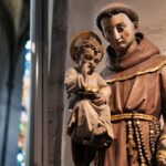 Man in Brown Long Sleeve Dress Shirt Statue