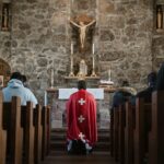 people sitting on church pew inside church