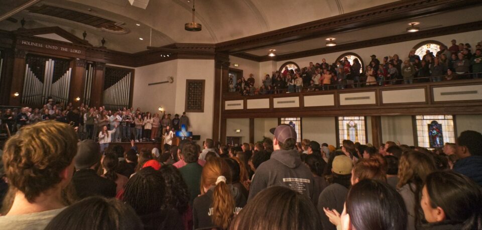 a large crowd of people in a building