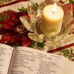 white pillar candle on clear glass holder