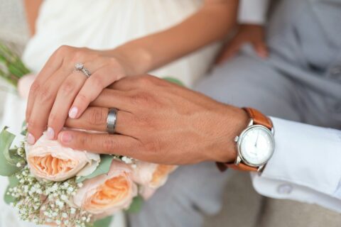man and woman holding hands