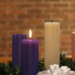 a group of candles sitting on top of a table