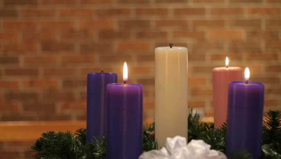 a group of candles sitting on top of a table