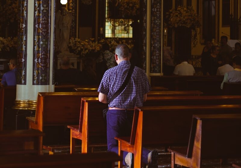 a man sitting in a chair in a church