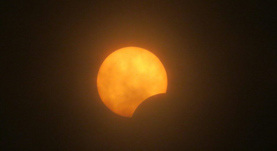a partial view of the moon during a partial solar eclipse