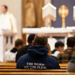 A group of people sitting in a church
