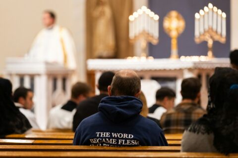 A group of people sitting in a church
