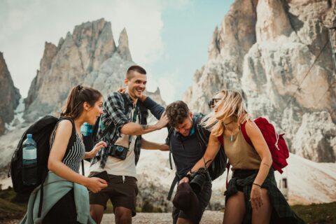 low-angle photography of two men playing beside two women