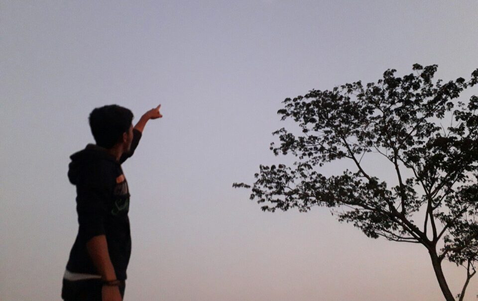 a man is flying a kite in the sky