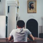 person praying inside church