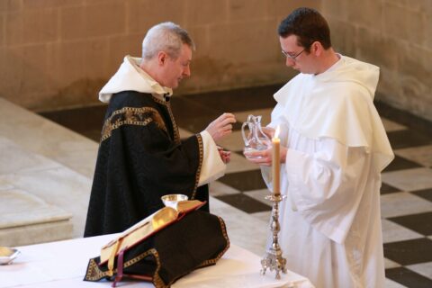 man in white dress shirt sitting beside man in white dress shirt