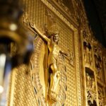 gold angel statue in a room