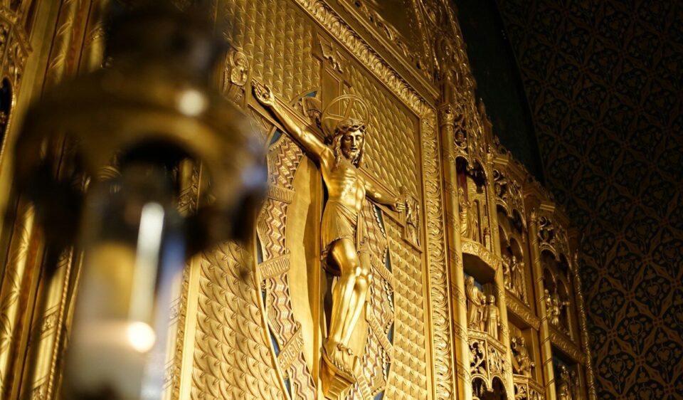 gold angel statue in a room