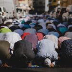 people kneeling and praying during daytime