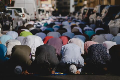 people kneeling and praying during daytime