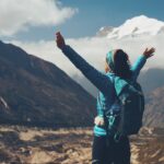 woman, backpack, raised, arms
