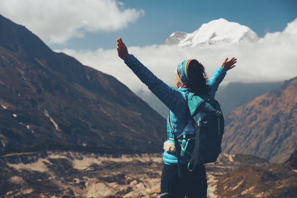 woman, backpack, raised, arms