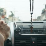 person driving car during daytime