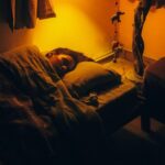 a person sleeping on a bed