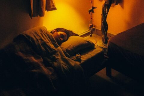 a person sleeping on a bed