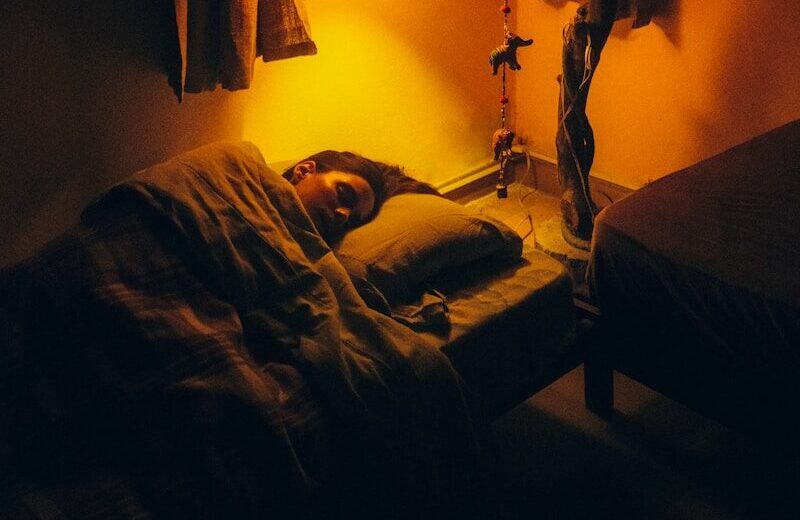 a person sleeping on a bed