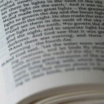 A bible is open to a passage of text.