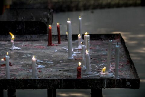a bunch of candles that are on a table