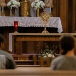 a couple of people sitting in front of a church alter