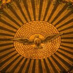 Close-up of intricate stained glass depicting the Holy Spirit in a Buffalo, NY church.