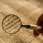 person holding magnifying glass