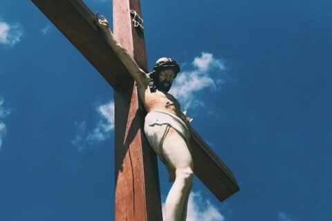 brown wooden cross under blue sky during daytime