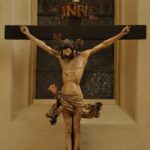 black crucifix on white wall