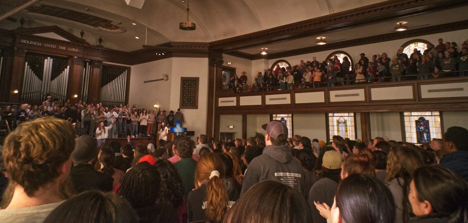 a large crowd of people in a building