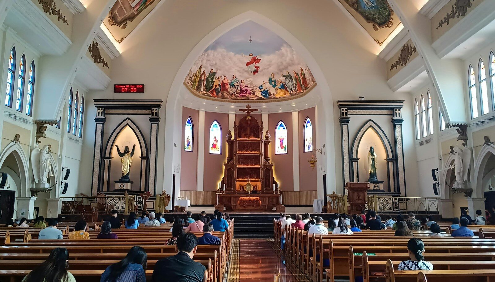 a church filled with lots of people sitting down