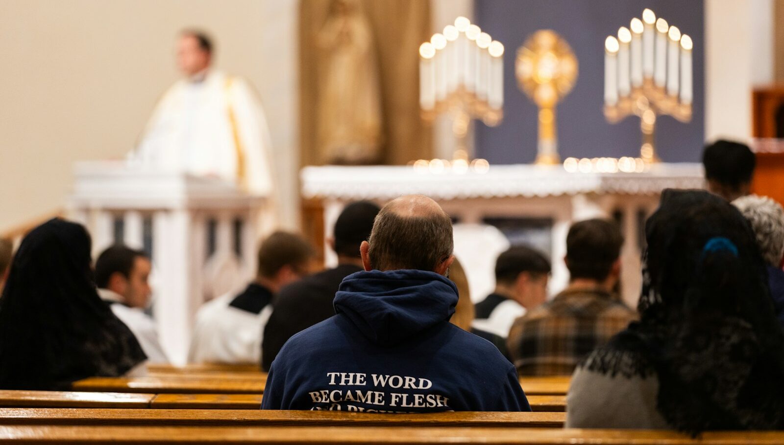 A group of people sitting in a church