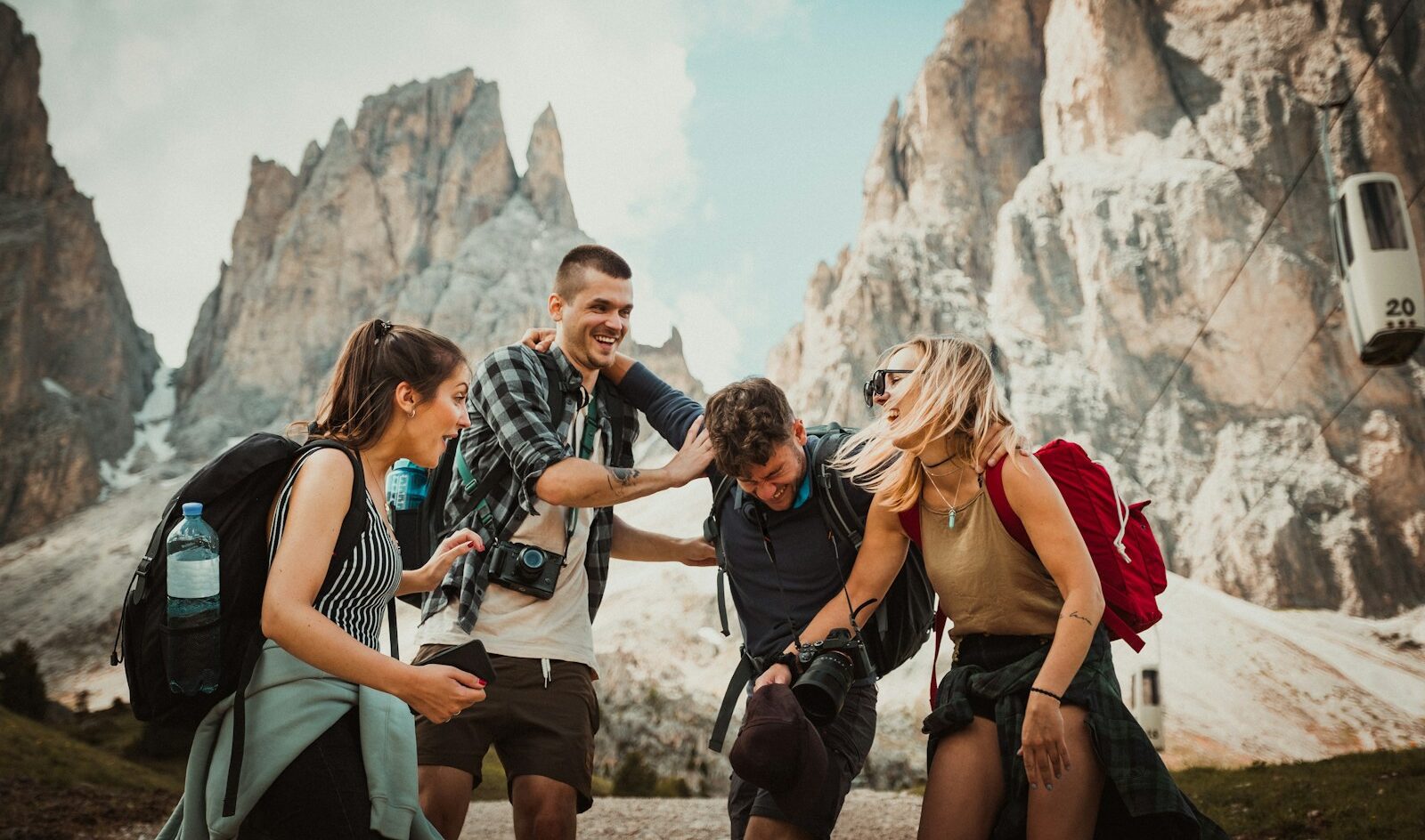 low-angle photography of two men playing beside two women