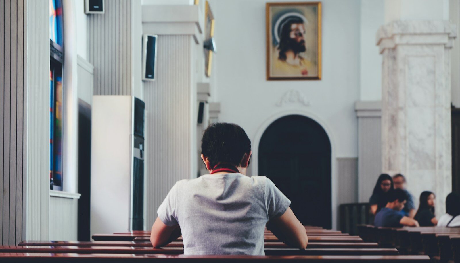 person praying inside church
