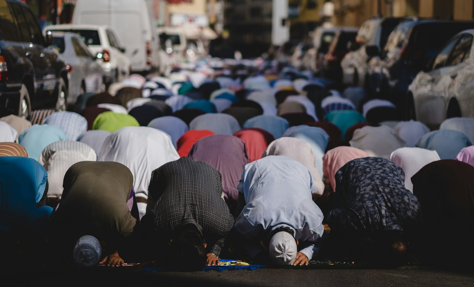people kneeling and praying during daytime