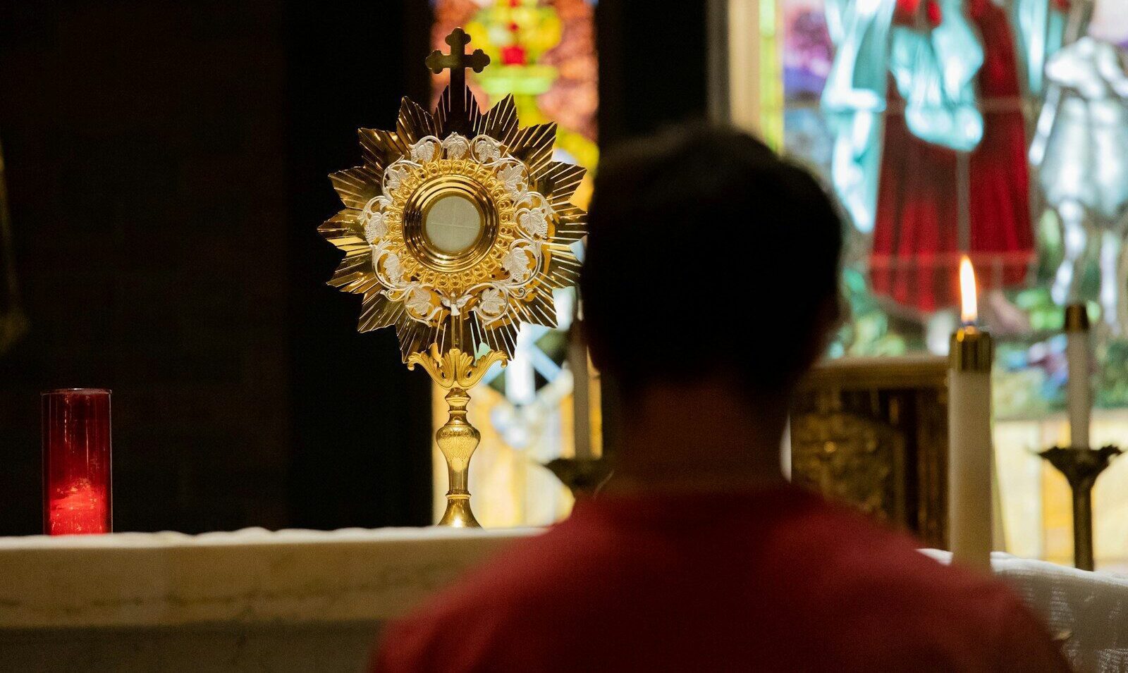 a man standing in front of a church alter