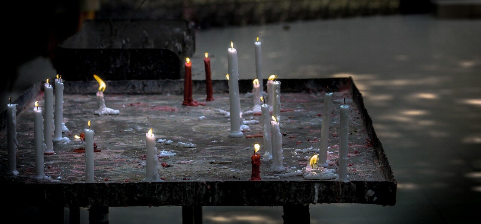 a bunch of candles that are on a table