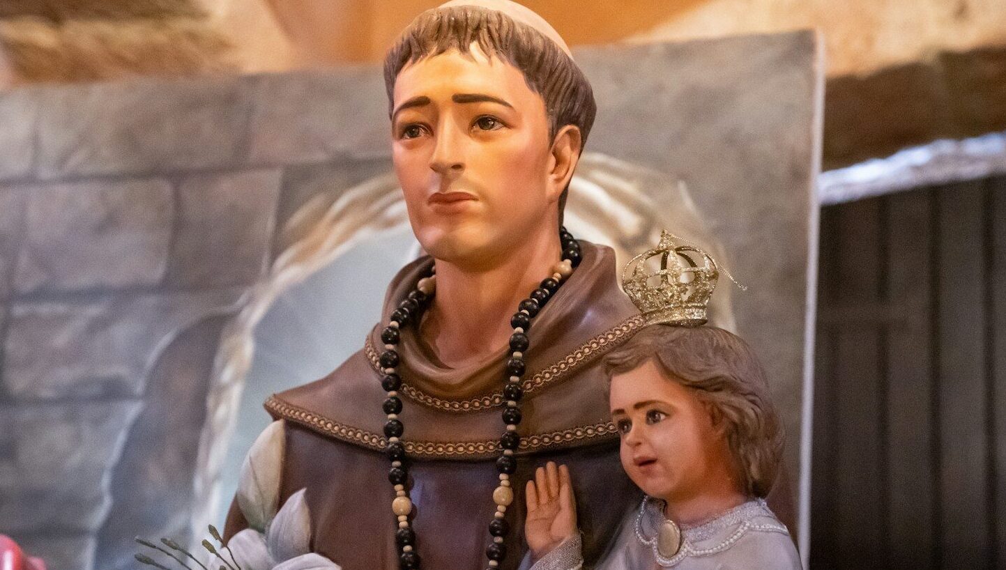a statue of a man and a little girl standing next to each other