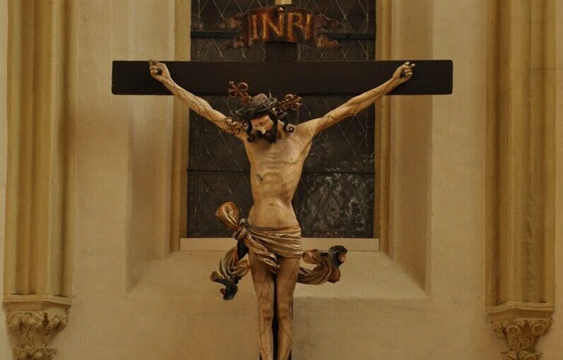 black crucifix on white wall
