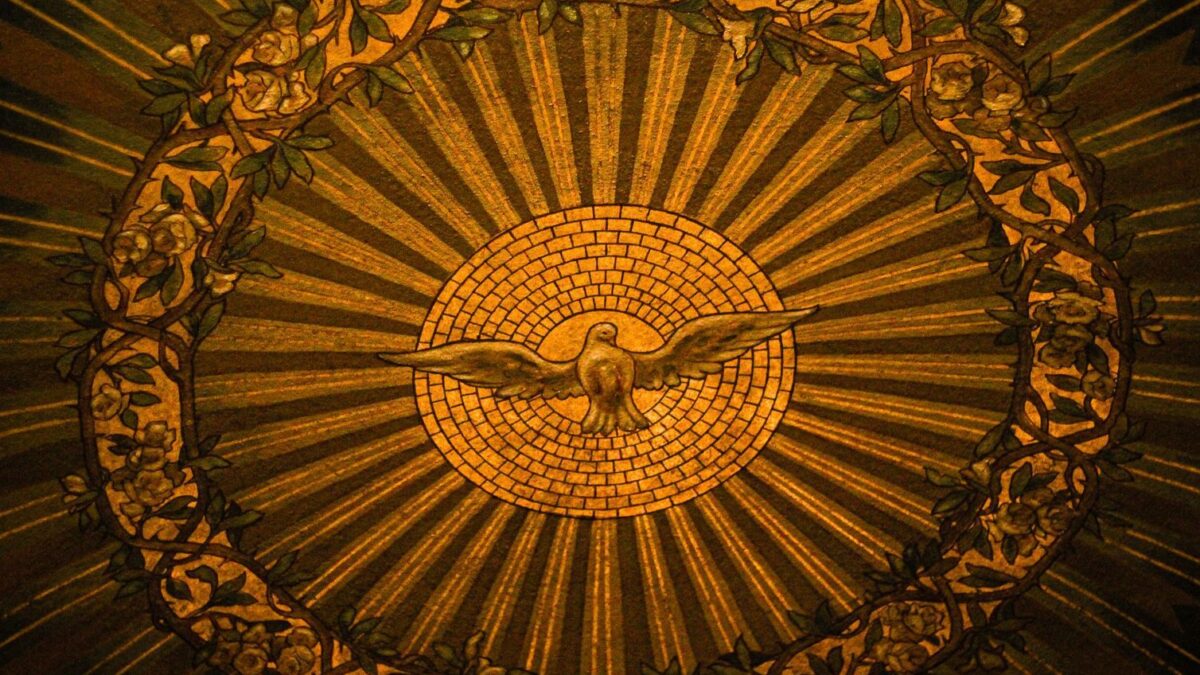 Close-up of intricate stained glass depicting the Holy Spirit in a Buffalo, NY church.