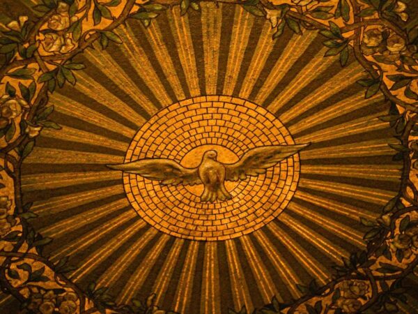 Close-up of intricate stained glass depicting the Holy Spirit in a Buffalo, NY church.