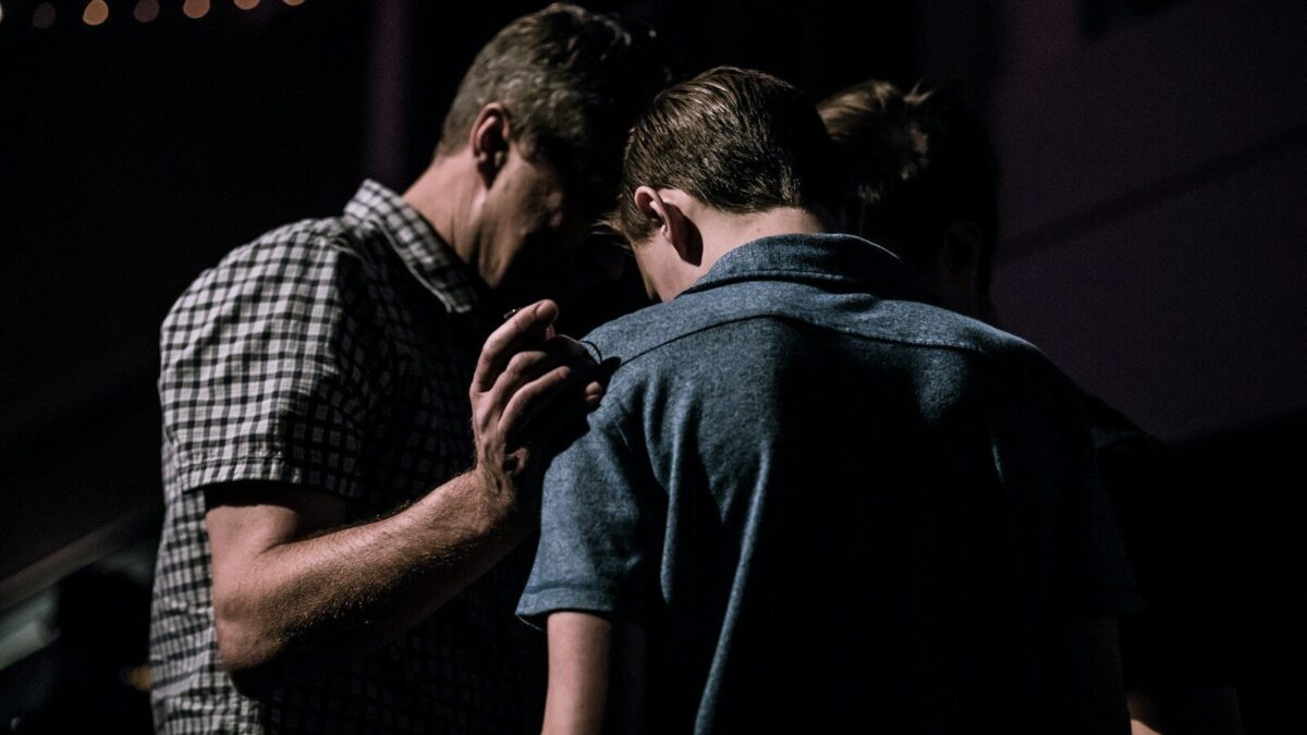 men touching each other's foreheads