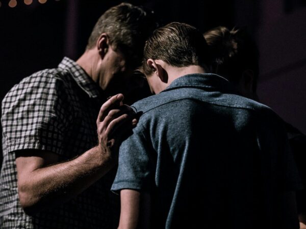 men touching each other's foreheads