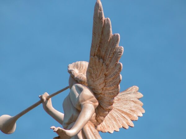a statue of an angel holding a baseball bat